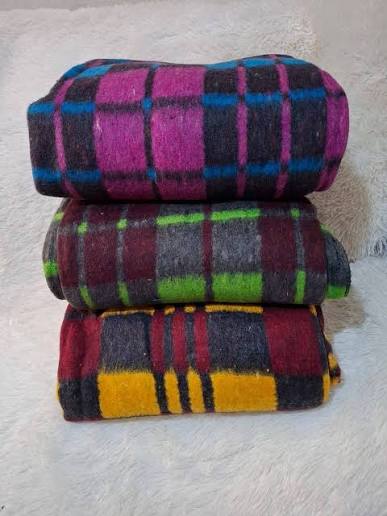 Jumla Uganda's Kampala warehouse with stacked wholesale blankets – fleece, cotton, and acrylic bulk options ready for dispatch.