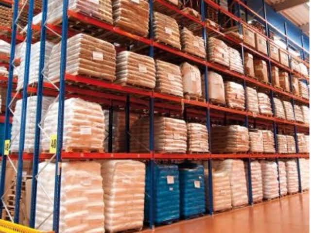 Jumla Uganda’s warehouse in Kampala – rows of palletised NGO supplies including medical boxes, shelter kits, and water tanks ready for dispatch to refugee settlements and districts across Uganda.